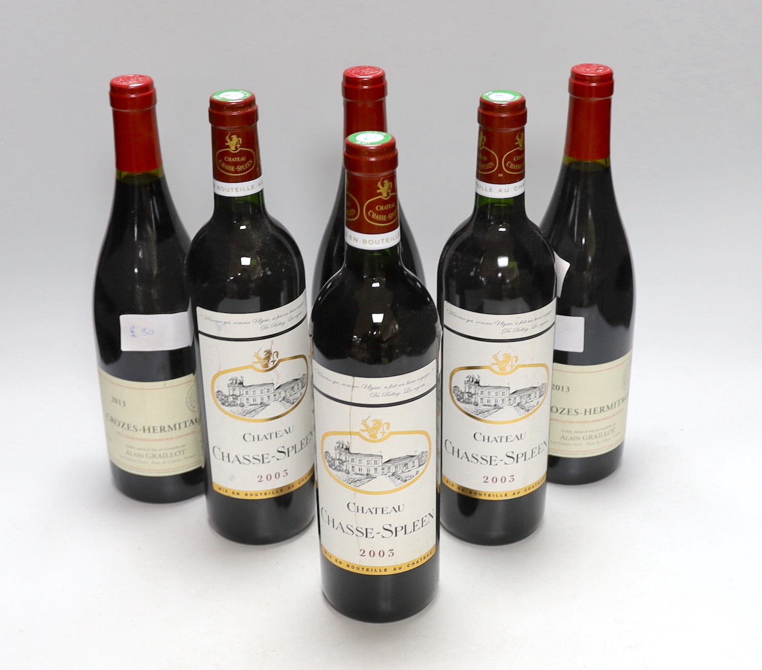 Three bottles of Crozes-Hermitage 2013 and three bottles of Chateau Chase-Spleen 2003